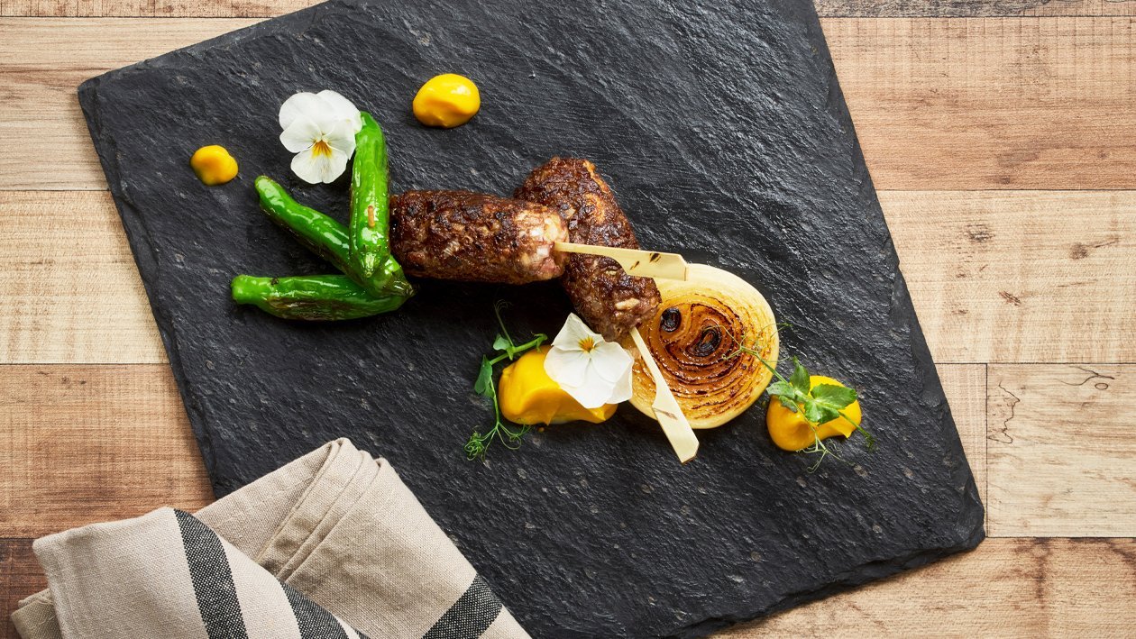 Beef Tsukune, with Salted Yolk Pumpkin Sauce, Grilled Onion, Shishito